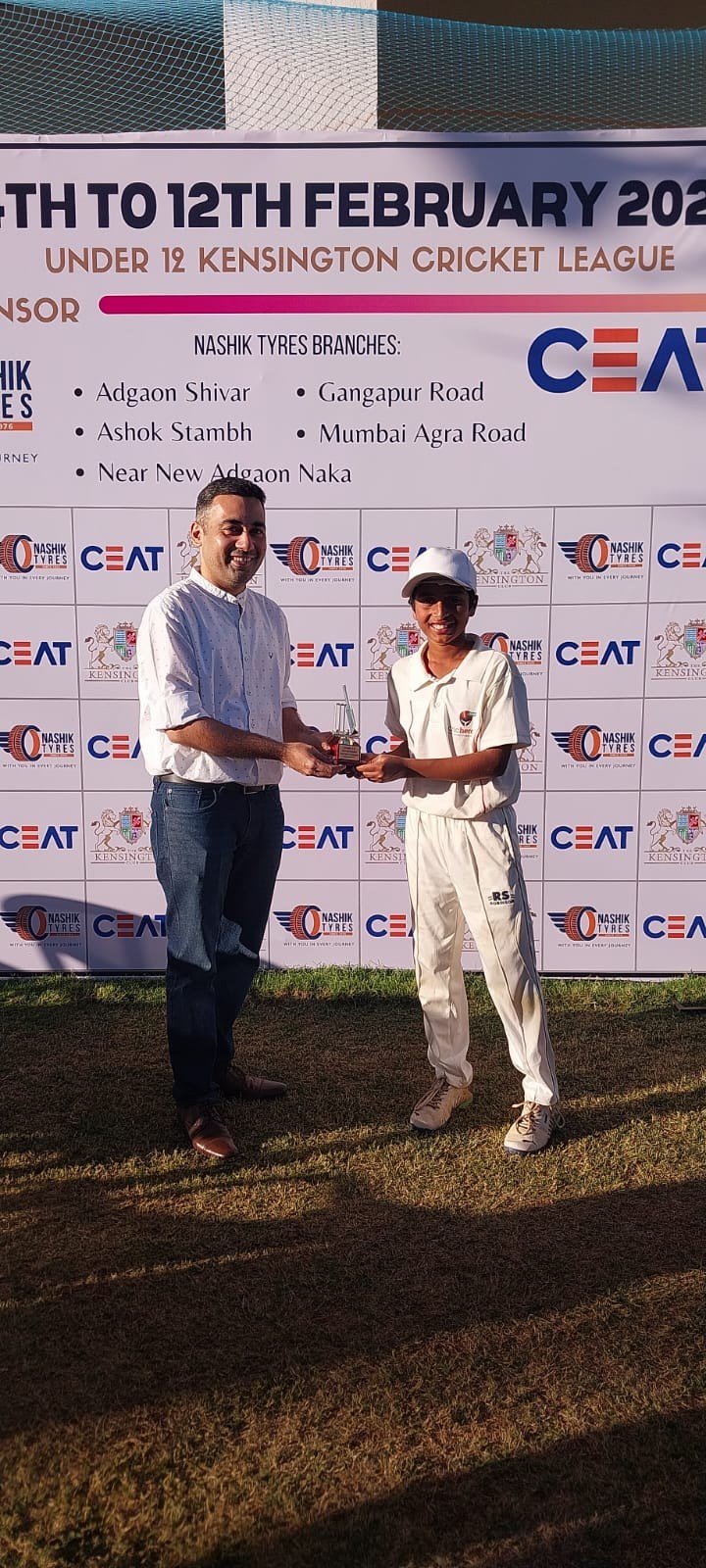Player receiving Under 12 Kensington Cricket League award