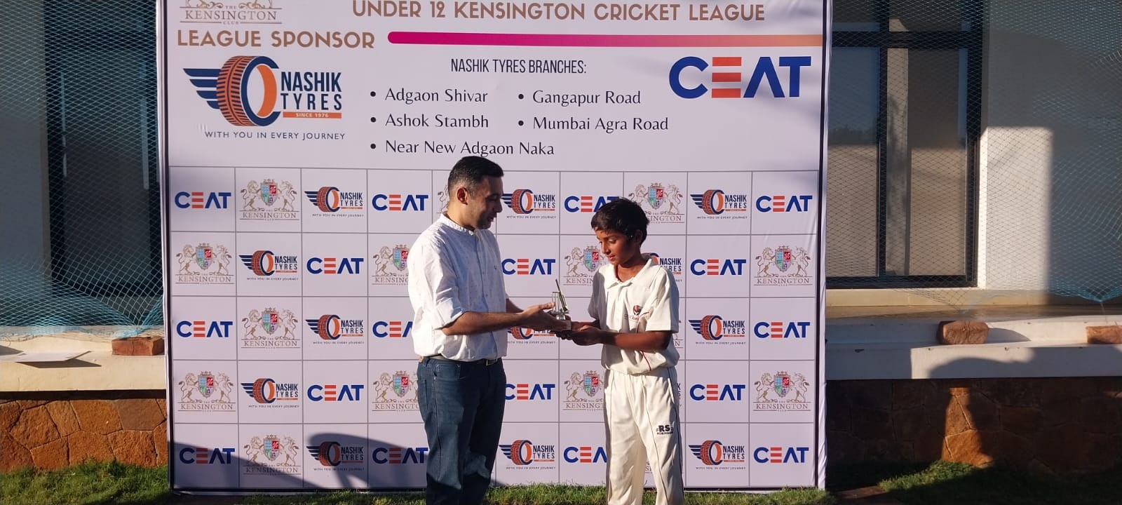 Player receiving Under 12 Kensington Cricket League award