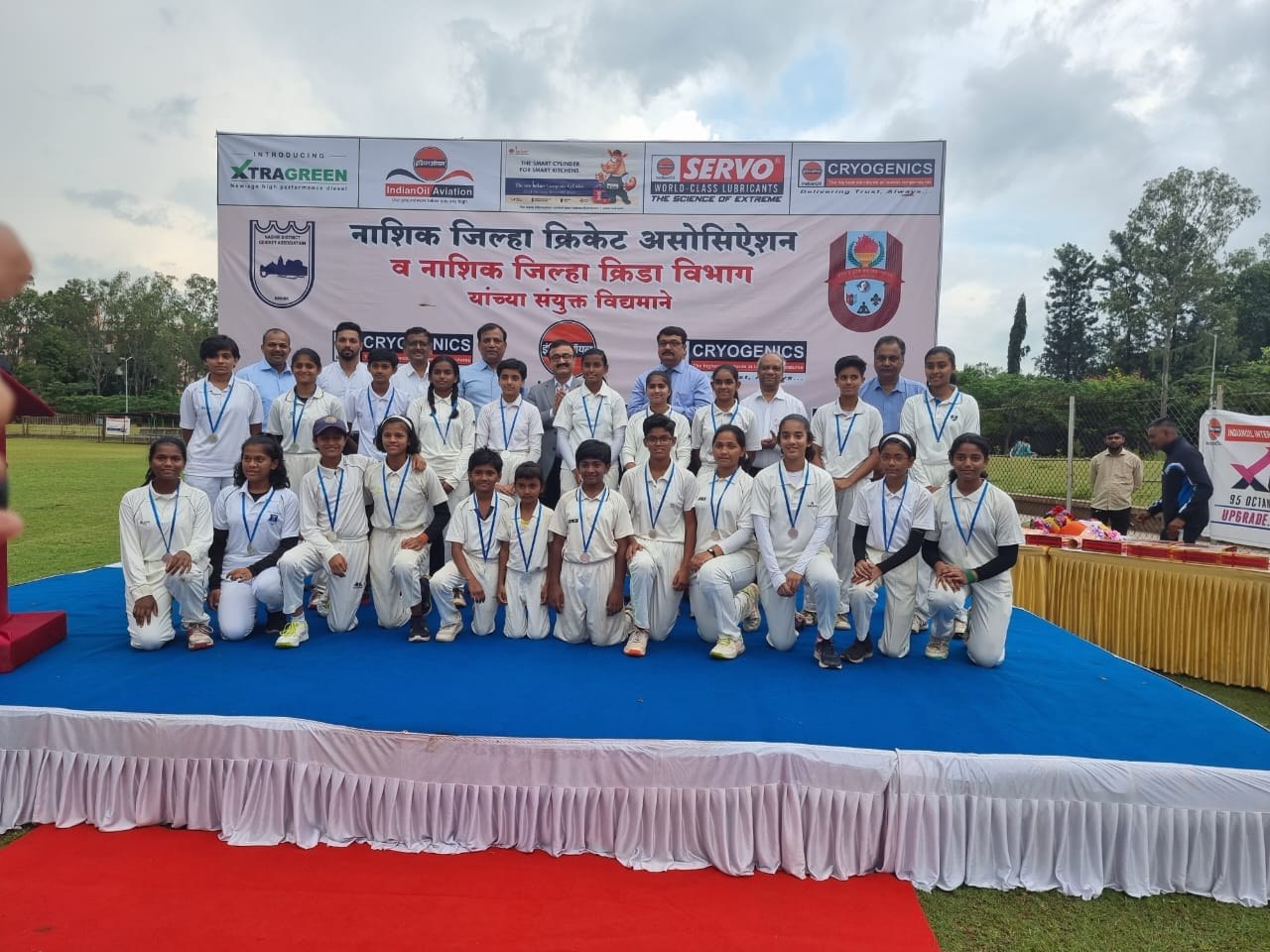Academy players with medals at Nashik District Cricket Association event