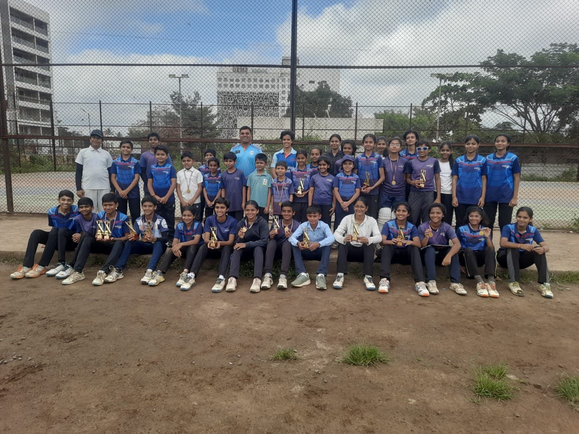 Academy team with trophies after a camp tournament