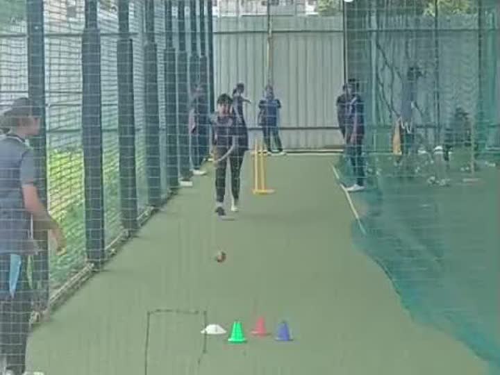 Bowler delivering the ball in the nets