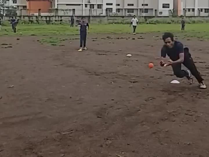 Player diving to field the ball during a drill
