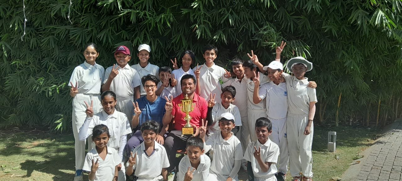 Academy team celebrating with the Inter-Academy Championship trophy