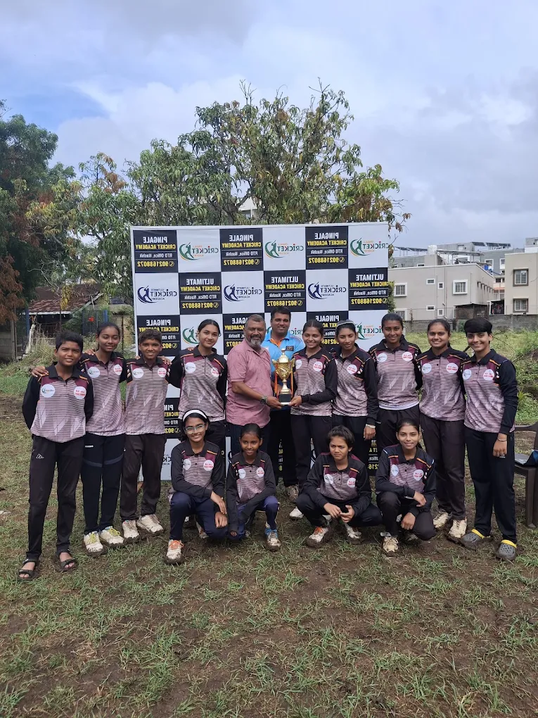 Team celebrating a tournament win with the trophy